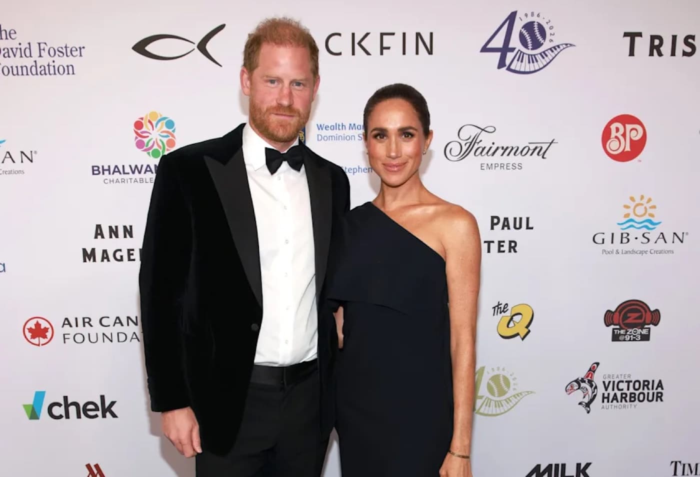 Meghan Markle and Prince Harry posing together at the David Foster Foundation gala