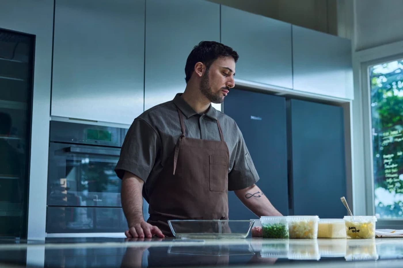 Chef Mirko Febbrile preparing ingredients at a kitchen counter